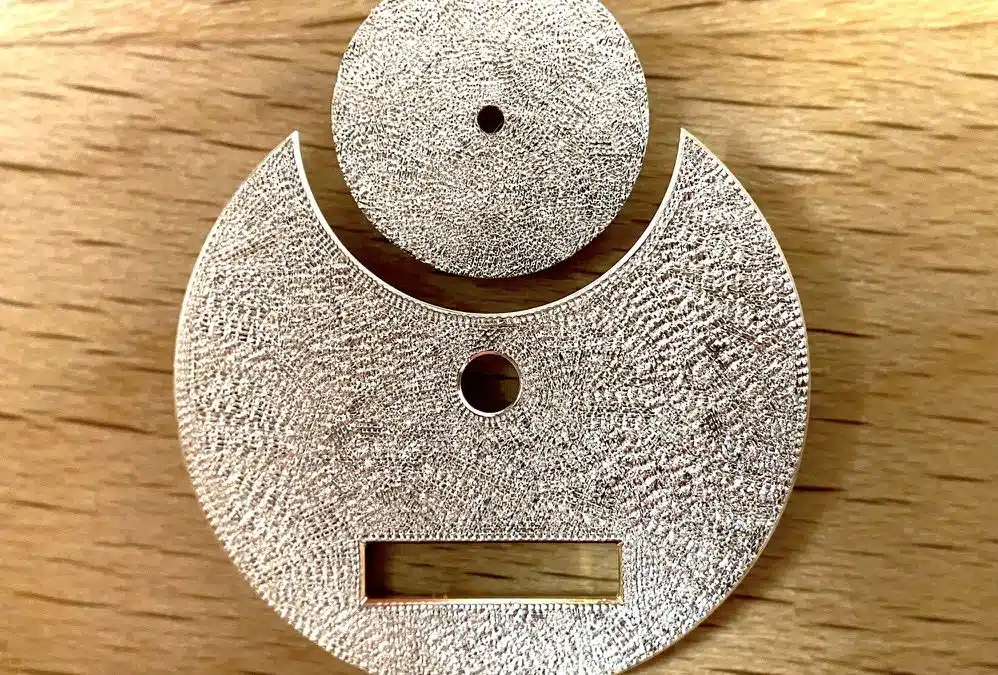 Sous-traitance en gravure horlogère : le prix de la main face à la machine